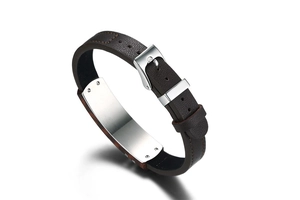 Macro detail of brown leather bracelet with brushed stainless steel ID plate and rivets