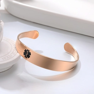 Polished rose gold medical alert cuff bracelet with black Star of Life symbol