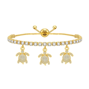 Gold turtle charm bracelet with sparkling white zircons and adjustable bolo clasp