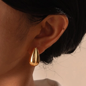 Elegant polished gold teardrop stud earrings for women with a minimalist mirror finish