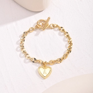 Gold stainless steel chunky chain bracelet with heart initial A pendant and OT clasp