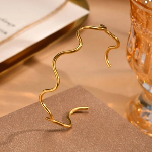 Minimalist 18K gold-plated wave-shaped open bangle bracelet with modern curved lines