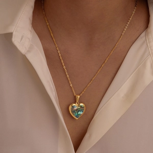 Golden stainless steel necklace with iridescent heart-shaped shell locket pendant