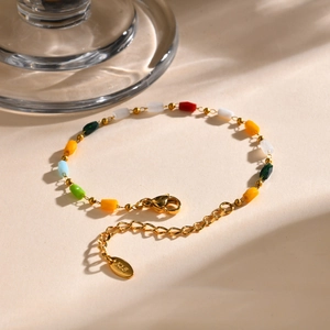 Detail of multi-colored beaded 18K gold chain with lobster clasp and K18 heart tag