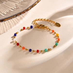 Close-up of 18K gold plated steel chain with colorful beads and K18 hallmark tag