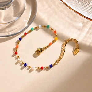 Close-up of 18K gold-plated chain bracelet with colorful cube beads and lobster clasp