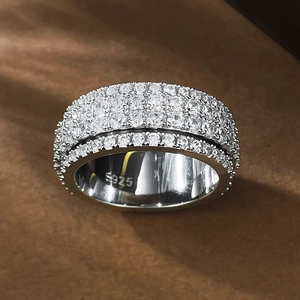 Macro shot of S925 silver wide band ring with multi-row pavé-set cubic zirconia