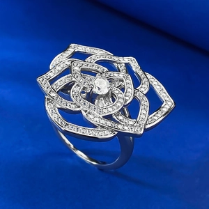 Detailed macro shot of S925 silver camellia ring with micro-pave cubic zirconia petals