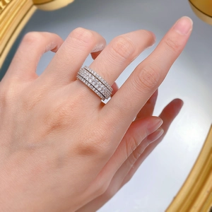 Luxurious layered silver ring with pavé cubic zirconia worn on a finger hand detail