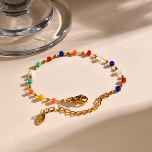 Detail of 18K gold stainless steel chain with colorful beads and lobster clasp closure