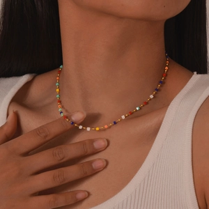 Detail showing colorful rectangular beads on a fine 18K gold-plated stainless steel chain