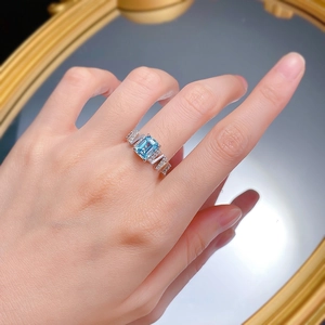 Elegant S925 silver ring with rectangular light blue gemstone and side accent diamonds