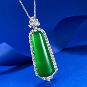Macro detail of S925 silver emerald green pendant necklace with sparkling micro-inlay stones