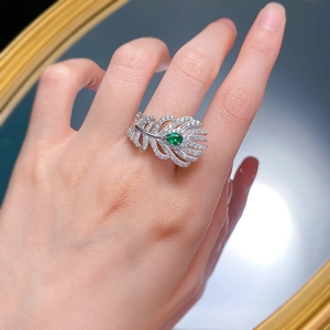 Elegant S925 silver feather ring with paved diamonds and pear-cut green gemstone