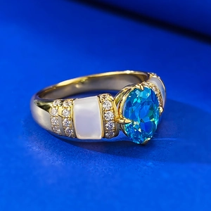 925 silver gold-plated ring with oval paraiba blue stone and white enamel details