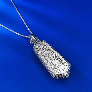 Detailed close-up of S925 sterling silver hollow floral pendant with intricate engravings