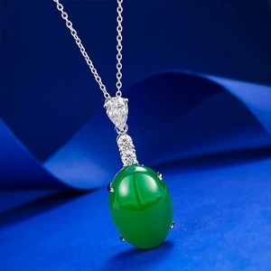 Elegant S925 silver necklace featuring an emerald green oval chalcedony pendant on blue silk
