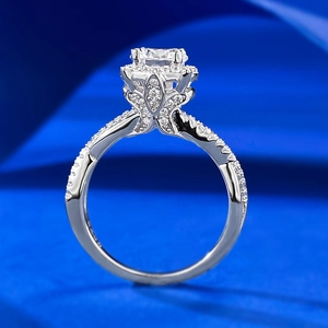 Luxury S925 silver 1 carat diamond ring with halo setting on blue silk fabric