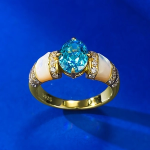 925 silver gold-plated ring with oval blue gemstone and white shell inlay detail