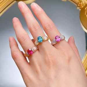 Detailed view of 925 silver gemstone rings with shell inlay and colorful oval stones