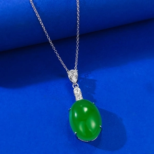 Close-up of S925 silver necklace with oval green gemstone pendant and zircon accents