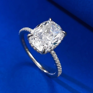 Macro shot of cushion-cut square cubic zirconia ring with micro-paved silver band