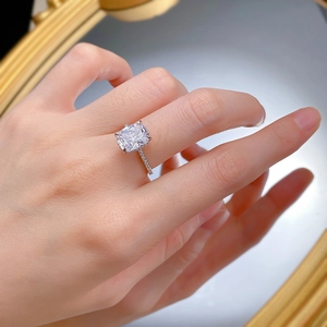 Detailed view of S925 sterling silver cushion cut square ring on finger with pave setting