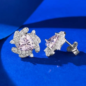 Detail of S925 sterling silver stud earrings with pink triangle stone and floral zircons
