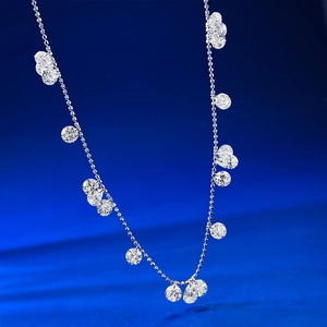 925 silver beaded necklace with multiple sparkling zircon drops on blue background