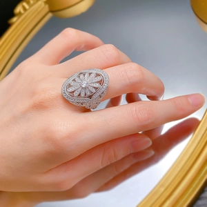 Macro shot of silver fireworks ring with oval stone and intricate zircon micro-pave details