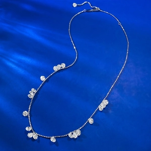 925 silver necklace with sparkling teardrop and round cut cubic zirconia on blue satin