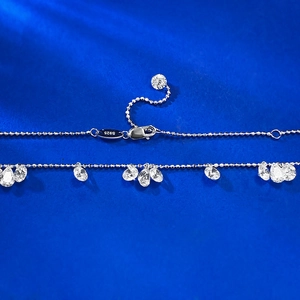 Detailed close-up of 925 sterling silver beaded necklace with pear-cut teardrop crystals