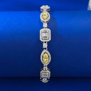 Macro view of silver bracelet with marquise yellow stone and geometric cubic zirconia