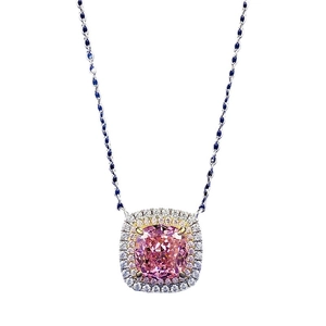 Pink cushion-cut padparadscha necklace with double diamond halo in a silver setting