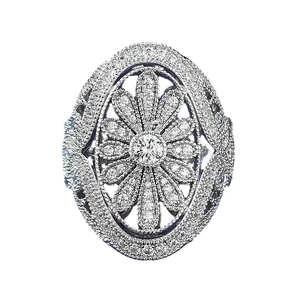 Luxurious floral vintage ring with pave-set diamonds and milgrain edges on white background
