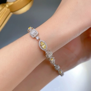 Detail of luxury 925 silver bracelet with marquise yellow and rectangle white diamonds