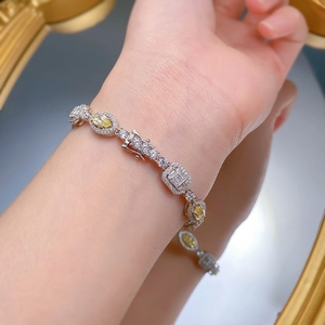 Macro detail of S925 silver bracelet featuring yellow marquise-cut stones and safety clasp