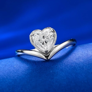 Elegant S925 silver ring featuring heart-cut diamond simulant on deep blue silk
