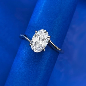 Elegant S925 silver ring featuring an oval cut solitaire diamond in a twisted bypass setting