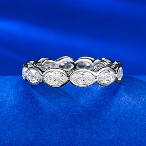Macro view of S925 silver eternity ring featuring marquise cut diamonds on blue velvet