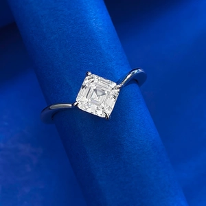Square Asscher cut S925 silver ring with clear stone on blue textured scroll