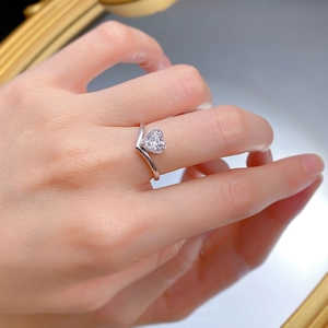 Macro shot of V-shaped S925 silver ring featuring a heart-cut diamond zircon on hand