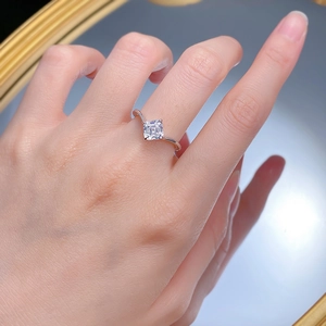 Elegant S925 silver ring featuring a square-cut diamond on a model's finger with mirror reflection
