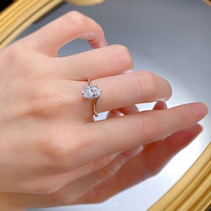 Macro detail of oval cut simulated diamond ring with an elegant twisted silver band