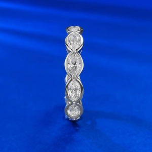Macro view of S925 silver ring featuring oval-cut pavé diamonds in marquee settings