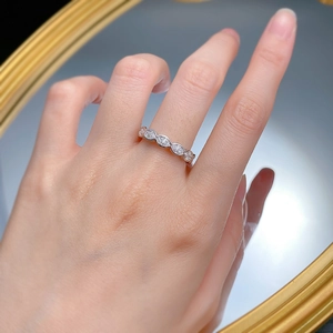 Macro view of S925 silver ring featuring marquise cut diamonds in a row setting