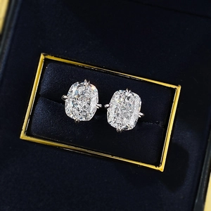 Detail of cushion-cut square zircon stud earrings with classic four-prong silver setting