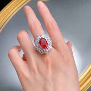 Luxurious S925 silver ring with oval ruby and marquise cubic zirconia on finger