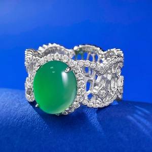 Vintage 925 silver plated ring featuring a large oval green agate and hollow filigree design