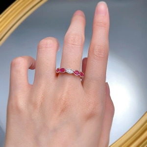 Detail of S925 silver ring featuring marquise-cut red gemstones and white zircon stones